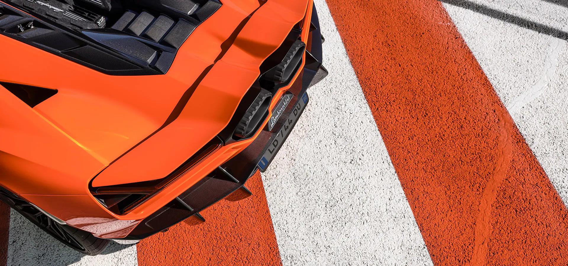 Rear view of Revuelto in Arancio Apodis, highlighting the V12 engine